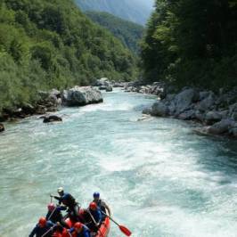 a group of people on a raft in a body of water