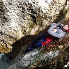 a person sitting on a rock