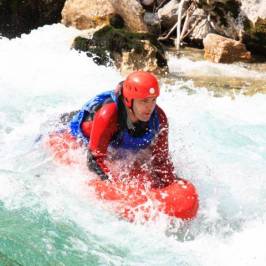 a man riding a wave on top of a body of water