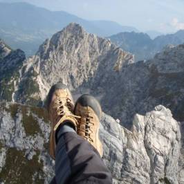 a man standing in front of a mountain