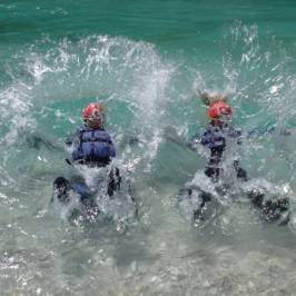 a person riding a wave on a surfboard in the water