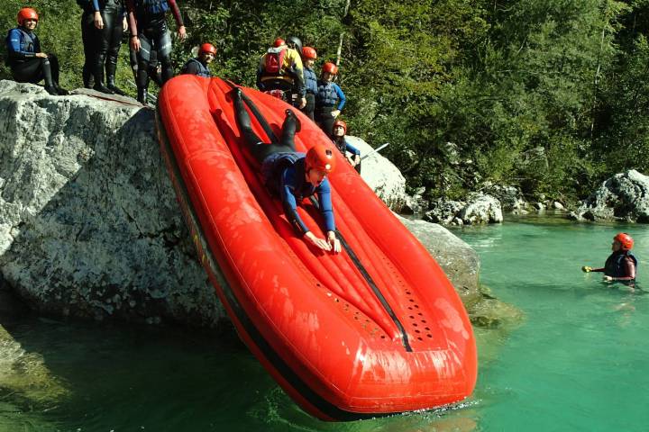 a group of people on a boat in the water