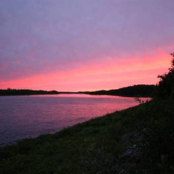 a sunset over a body of water