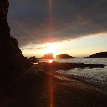 a sunset over a body of water