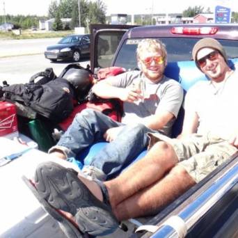 a man sitting on a motorcycle
