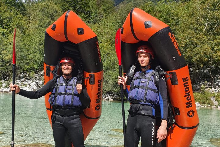 a group of people standing on top of a mountain