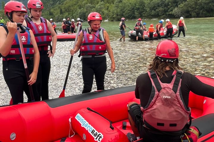 a group of people standing on top of a mountain